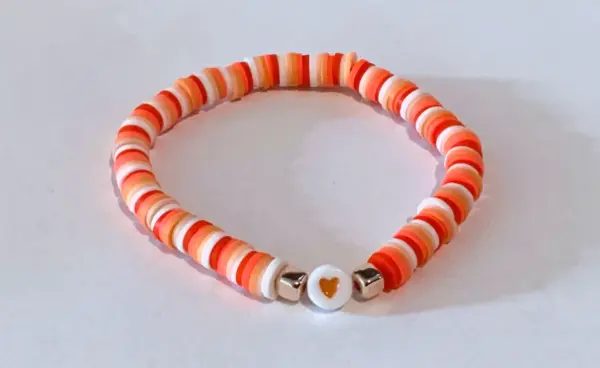 Orange with heart shaped charm Bracelet