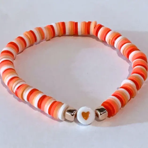 Orange with heart shaped charm Bracelet